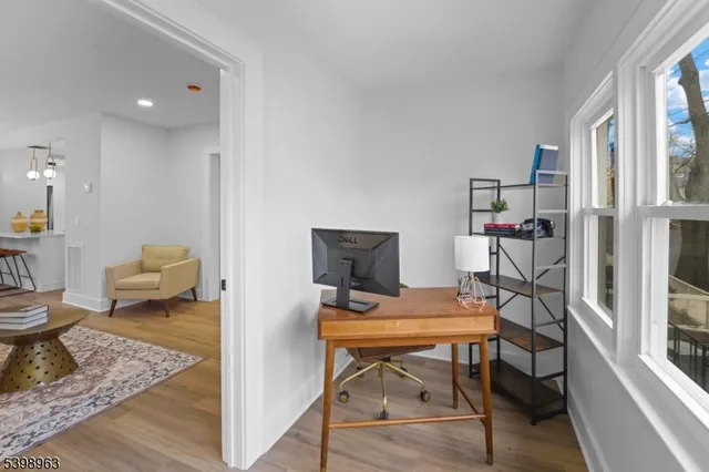 a workspace with furniture and a gate