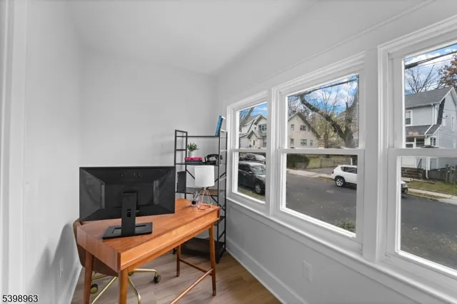 a reading room with furniture and a window