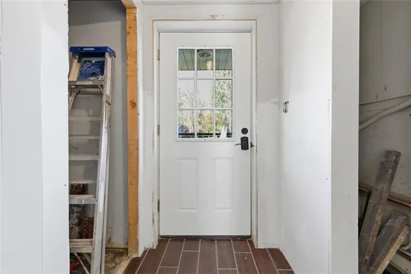 a view of front door with wooden floor