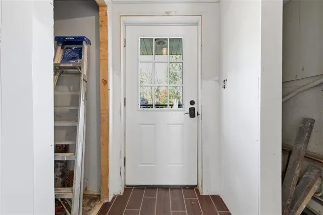 a view of front door with wooden floor