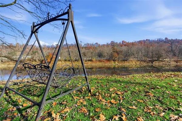 a view of lake with a yard