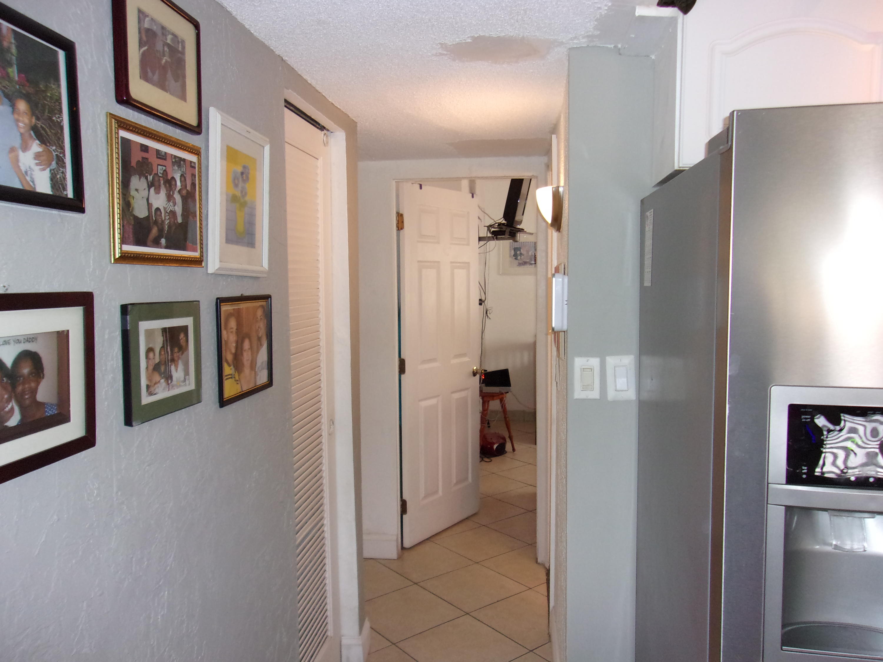 5588 South Rue Road West Palm Beach, FL 33415 - Photo 10 of 29 a view of a kitchen with furniture and refrigerator
