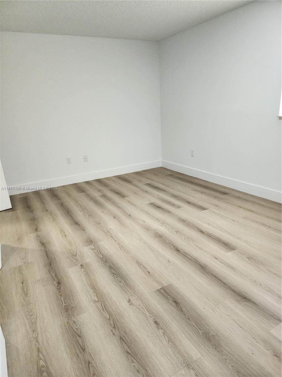 8343 Lake Drive, Unit 403 Doral, FL 33166 - Photo 5 of 8 a view of empty room