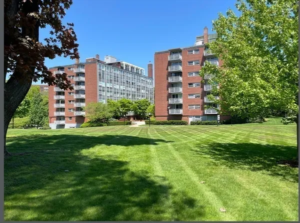 a view of a building with a yard