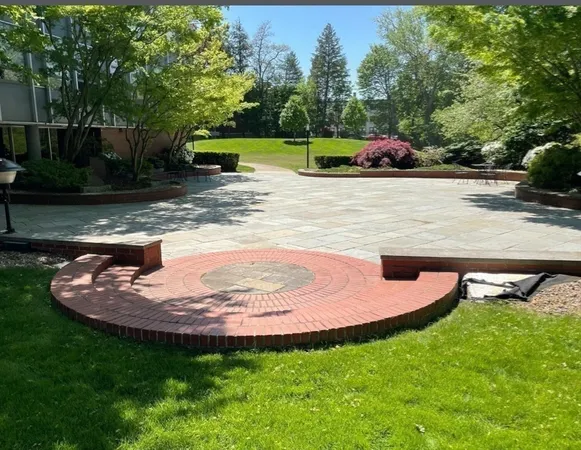a view of a backyard with swimming pool