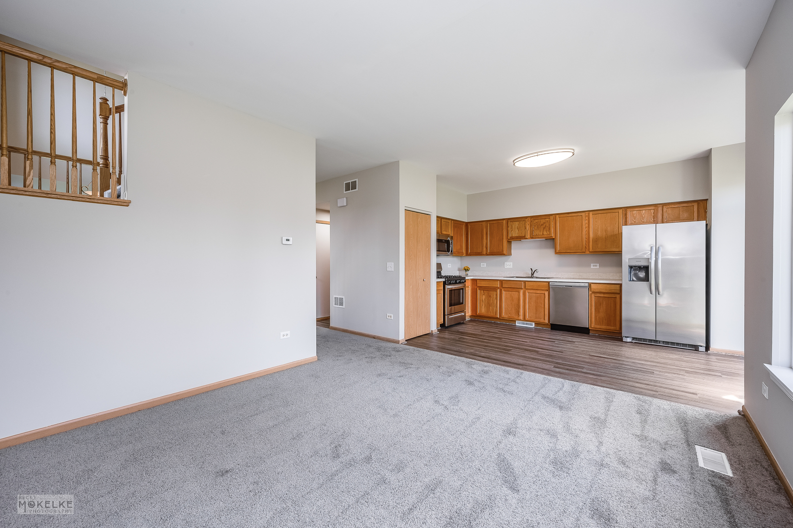 4212 Dillon Street Plano, IL 60545 - Photo 13 of 26 an empty room with a kitchen and a window