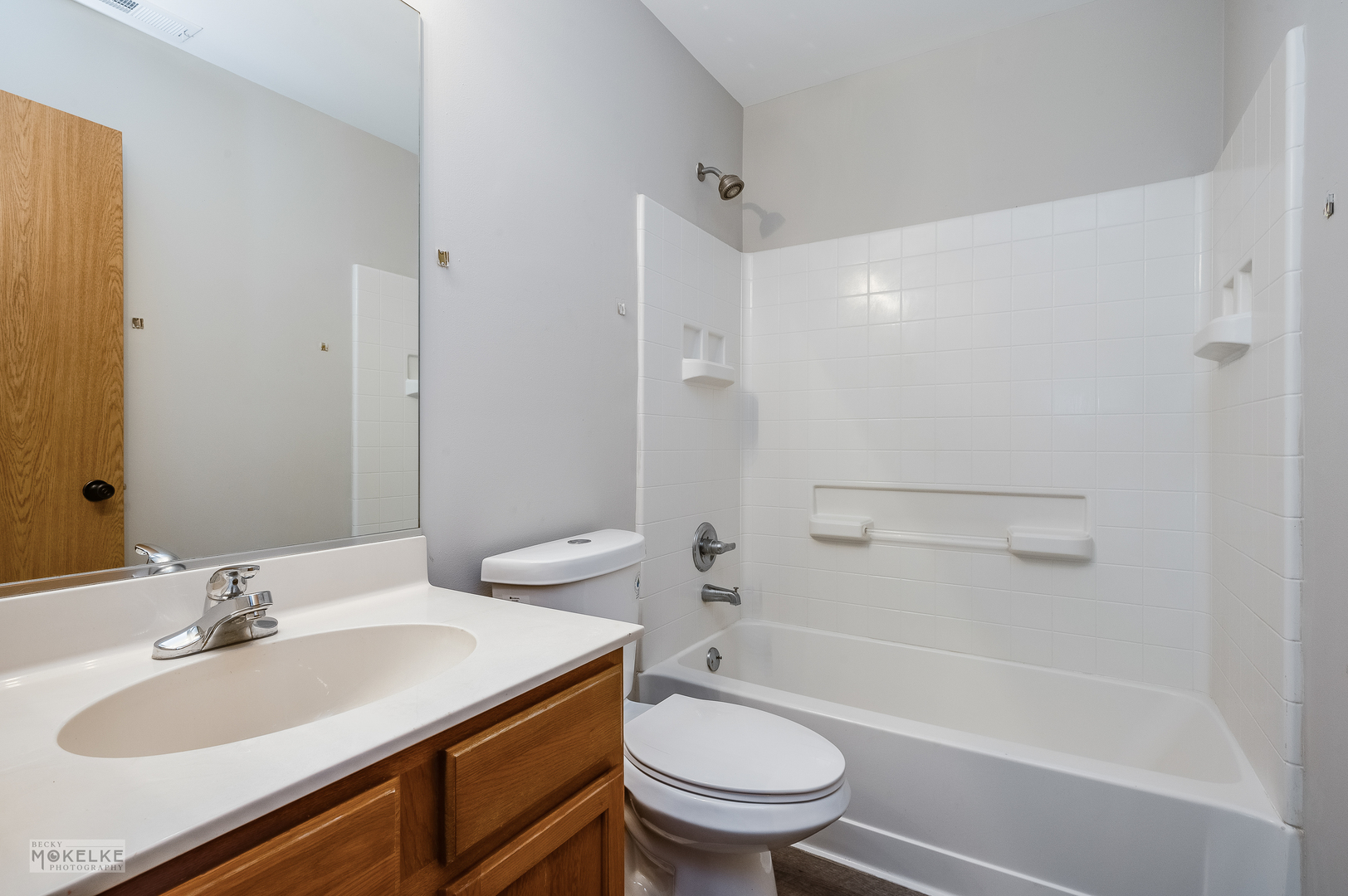 4212 Dillon Street Plano, IL 60545 - Photo 23 of 26 a bathroom with a sink toilet vanity and shower