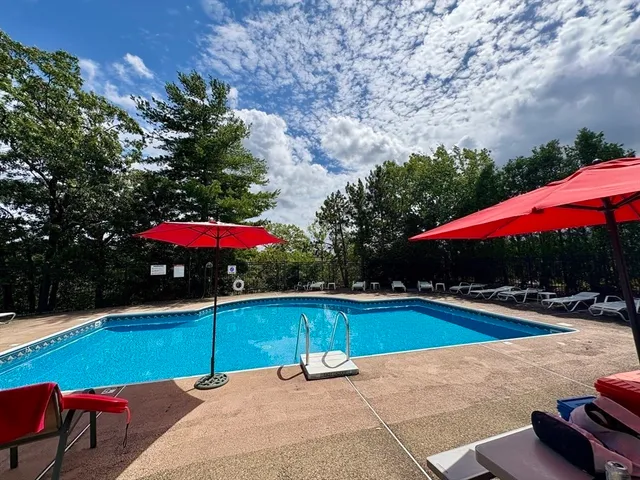 a view of a swimming pool with a patio