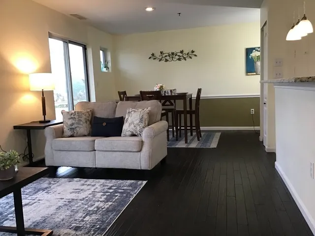 a living room with furniture and a table