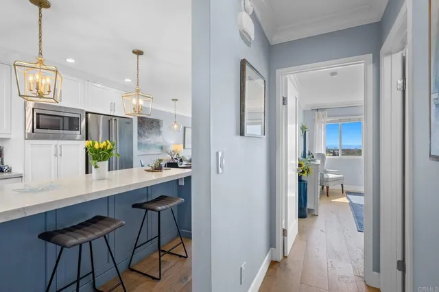 a view of a kitchen from the hallway