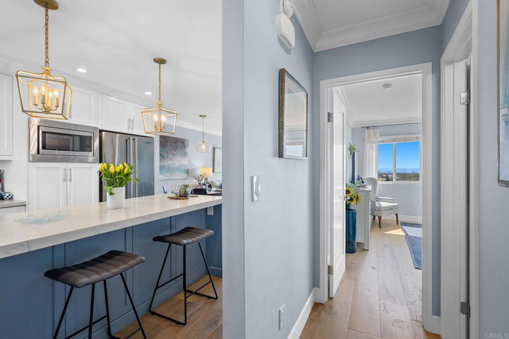 908 Caminito Madrigal, Unit D Carlsbad, CA 92011 - Photo 12 of 23 a view of a kitchen from the hallway
