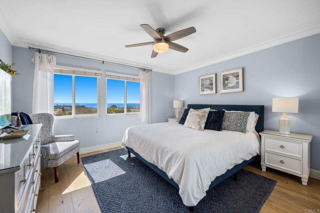 908 Caminito Madrigal, Unit D Carlsbad, CA 92011 - Photo 13 of 23 a bed room with a bed and a window