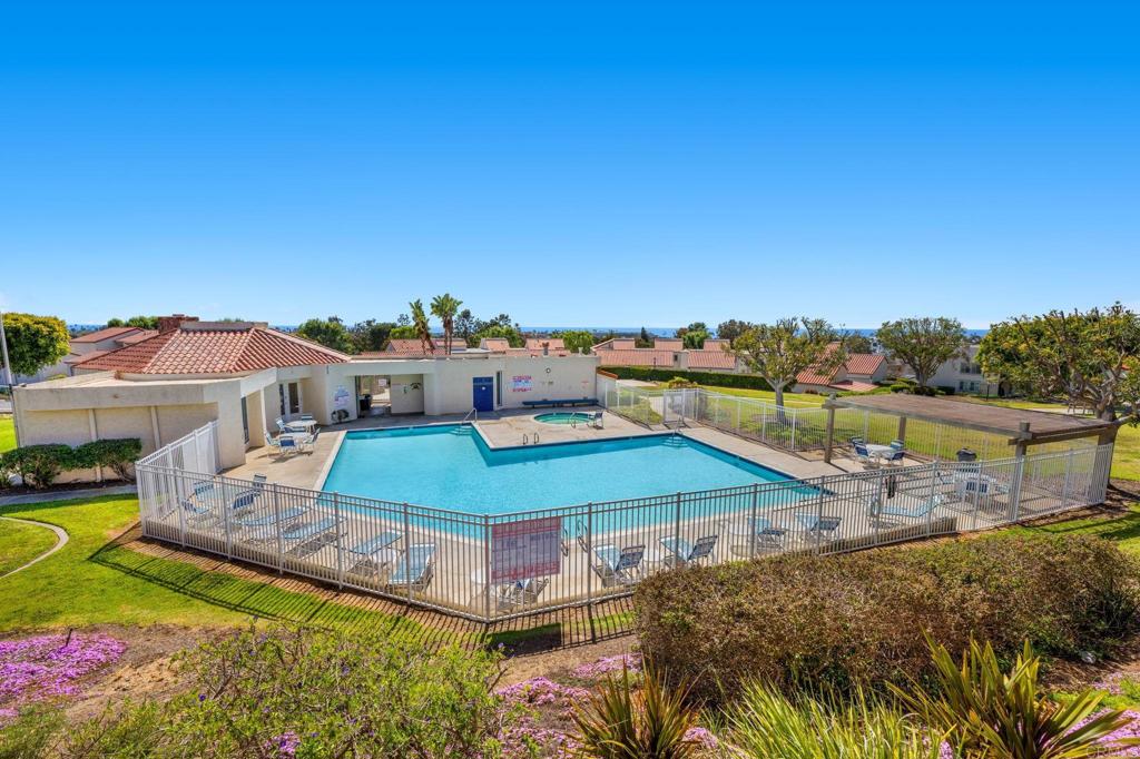 908 Caminito Madrigal, Unit D Carlsbad, CA 92011 - Photo 19 of 23 a aerial view of a house with a big yard