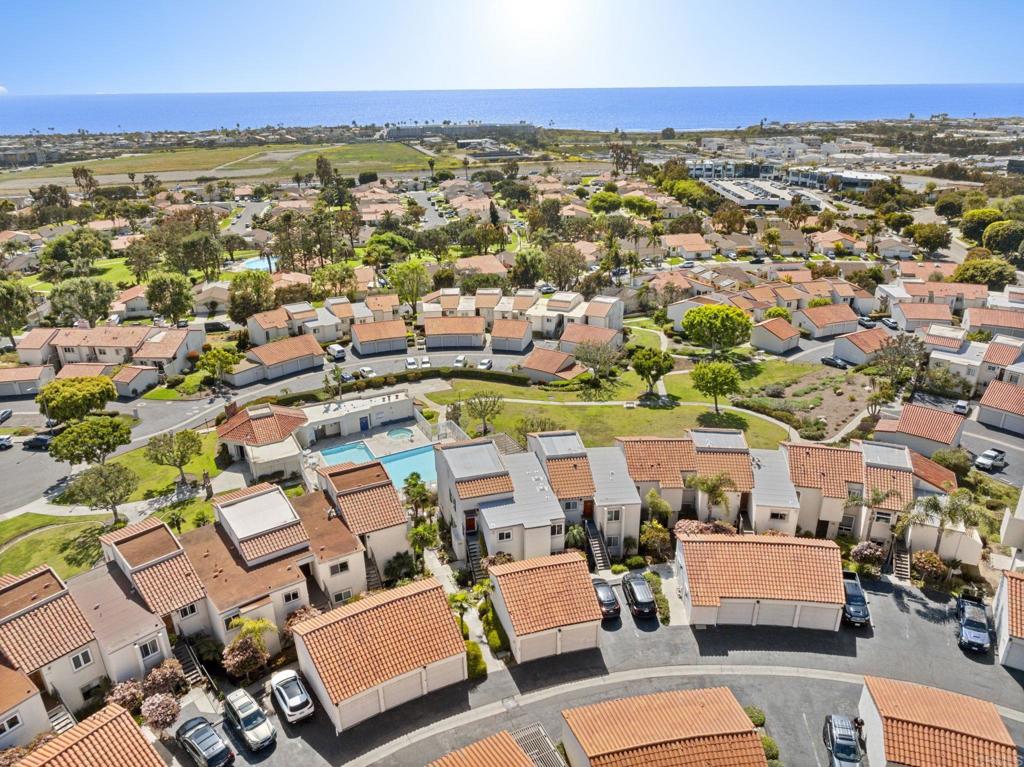 908 Caminito Madrigal, Unit D Carlsbad, CA 92011 - Photo 21 of 23 an aerial view of residential houses with outdoor space