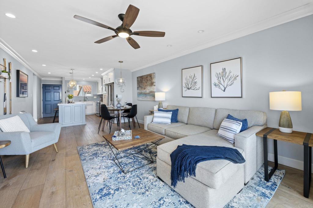 908 Caminito Madrigal, Unit D Carlsbad, CA 92011 - Photo 8 of 23 a living room with furniture and kitchen view