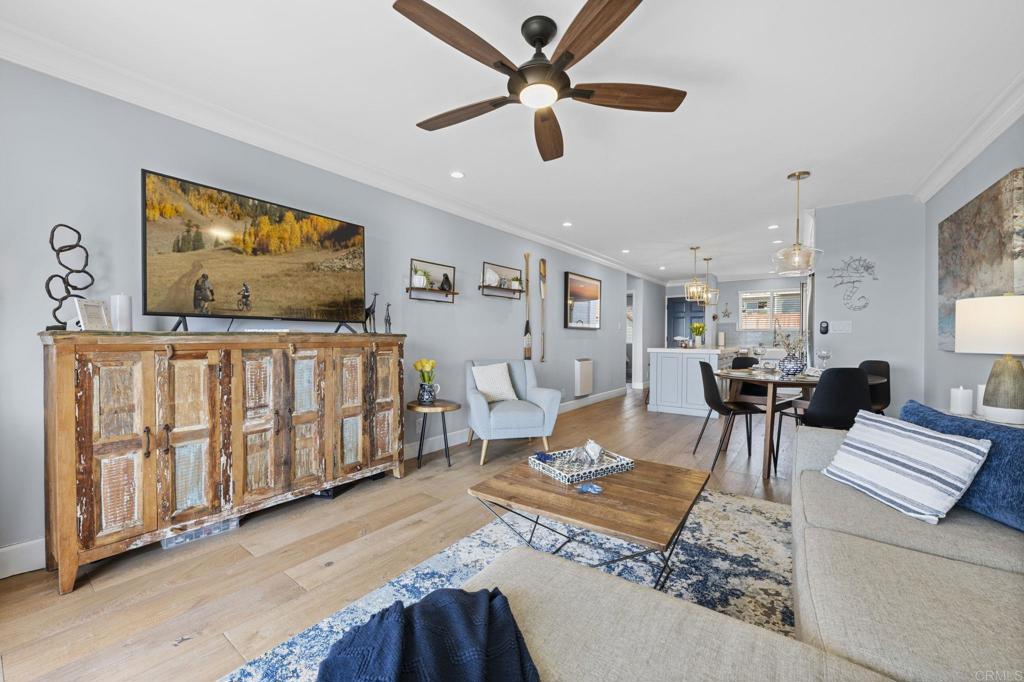 908 Caminito Madrigal, Unit D Carlsbad, CA 92011 - Photo 9 of 23 a living room with furniture and wooden floor