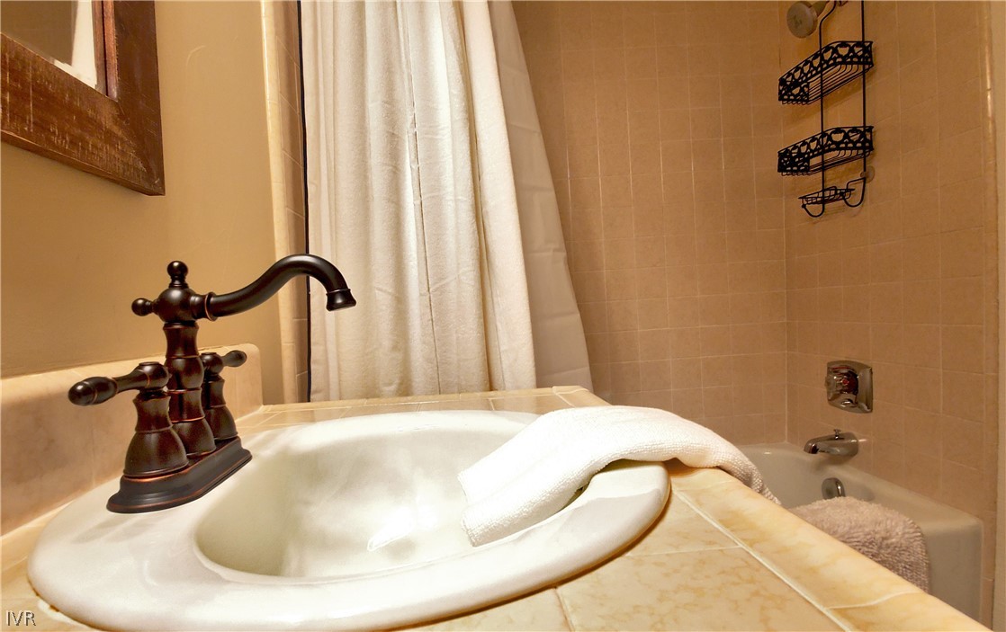 333 Ski Way, Unit 275 Incline Village, NV 89451 - Photo 15 of 18 a bathroom with a sink and a tub