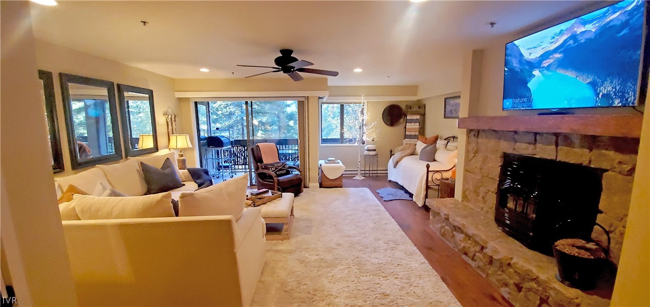 333 Ski Way, Unit 275 Incline Village, NV 89451 - Photo 3 of 18 a living room with furniture a flat screen tv and a fireplace