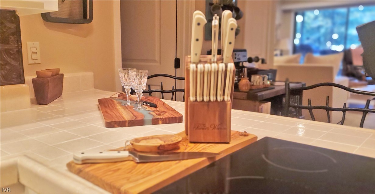 333 Ski Way, Unit 275 Incline Village, NV 89451 - Photo 8 of 18 a kitchen with a granite countertop sink and a white cabinets
