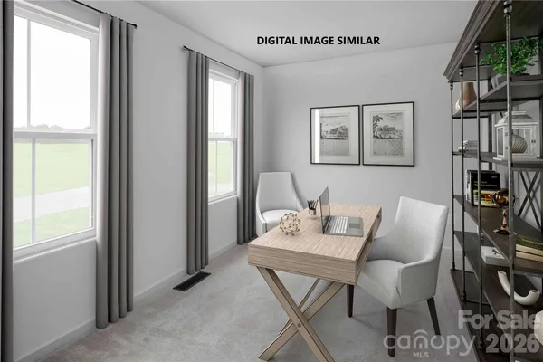 a view of a livingroom with furniture and a window