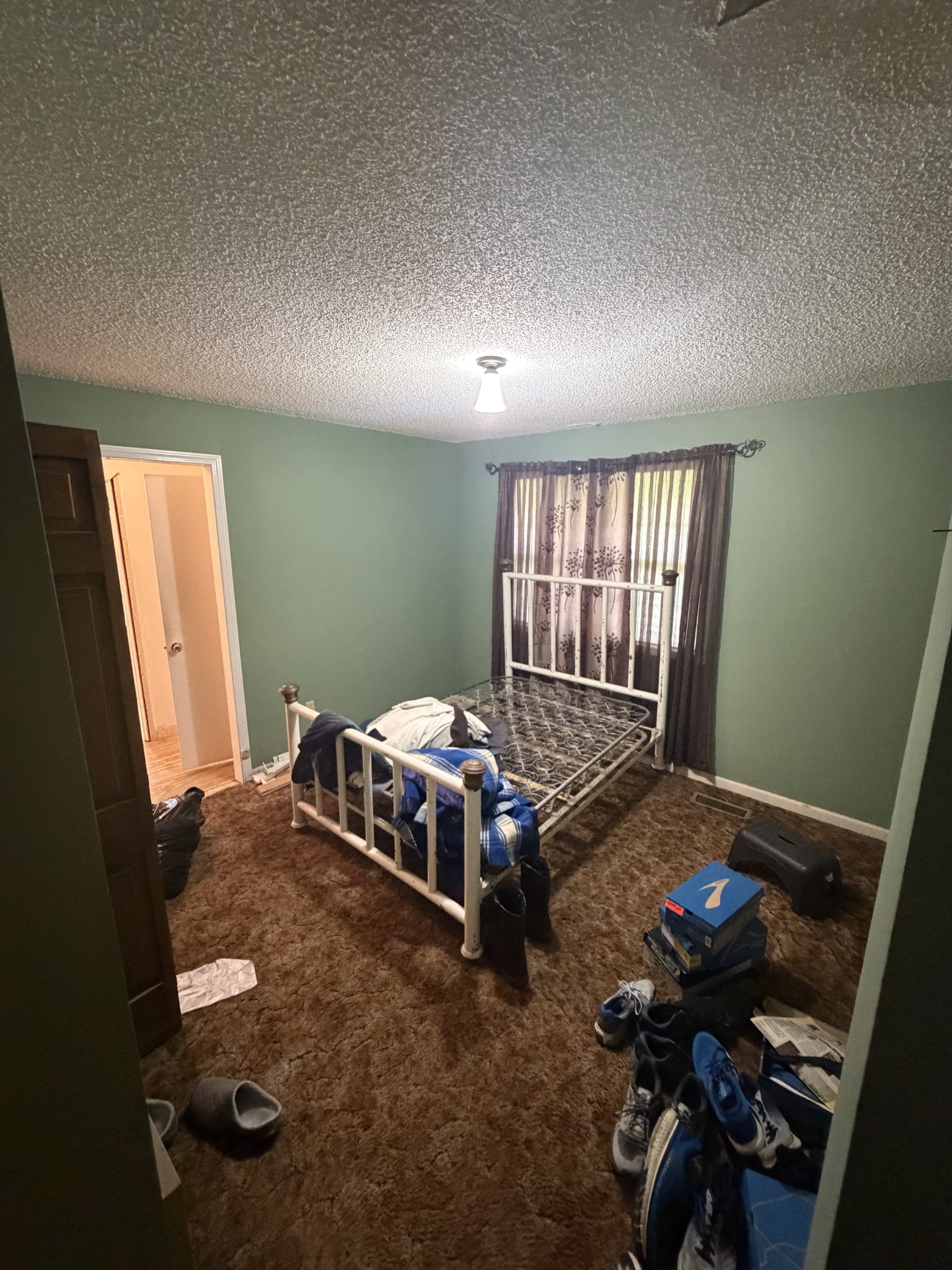 490 Boldan Road Reagan, TN 38368 - Photo 12 of 19 a bedroom with a bed and a window