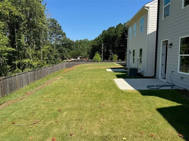 a view of yard with swimming pool