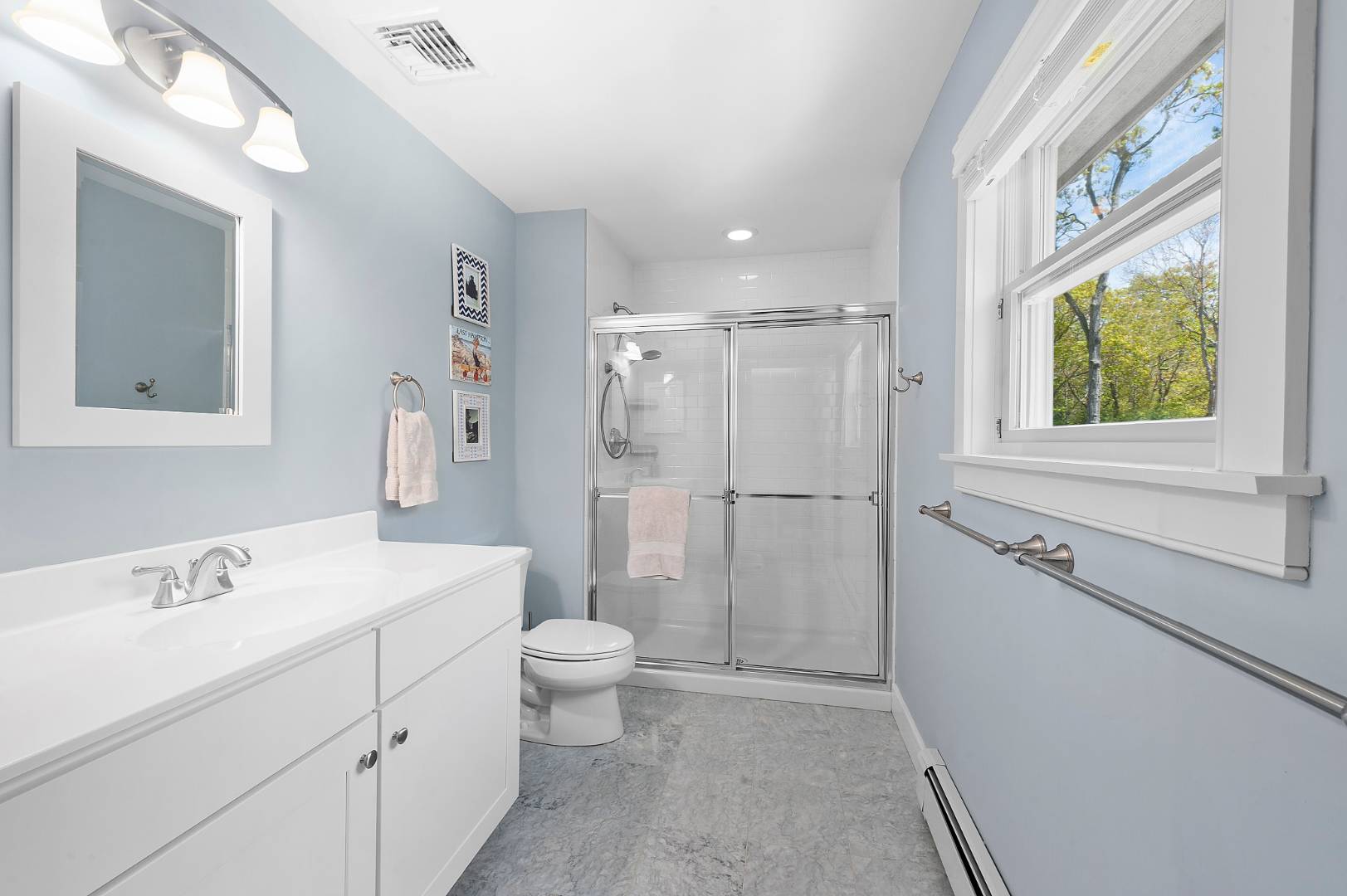 231 Norfolk Drive East Hampton, NY 11937 - Photo 12 of 17 a bathroom with a shower sink vanity mirror and toilet