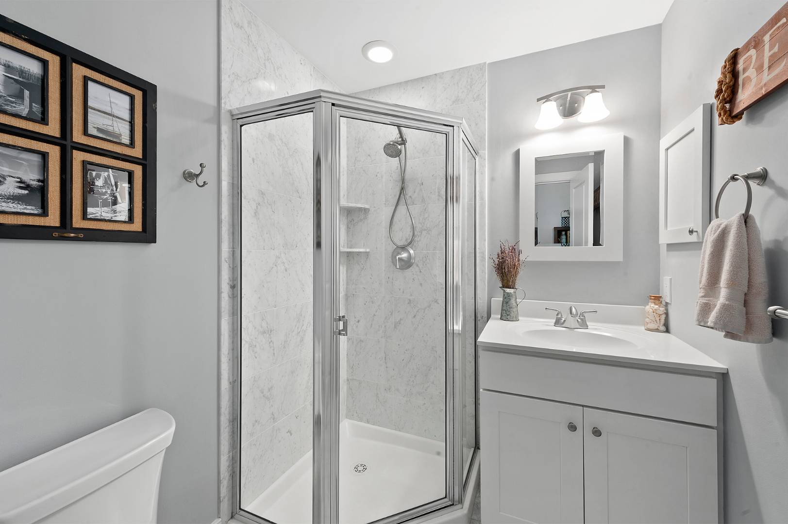231 Norfolk Drive East Hampton, NY 11937 - Photo 15 of 17 a bathroom with a shower sink vanity and toilet