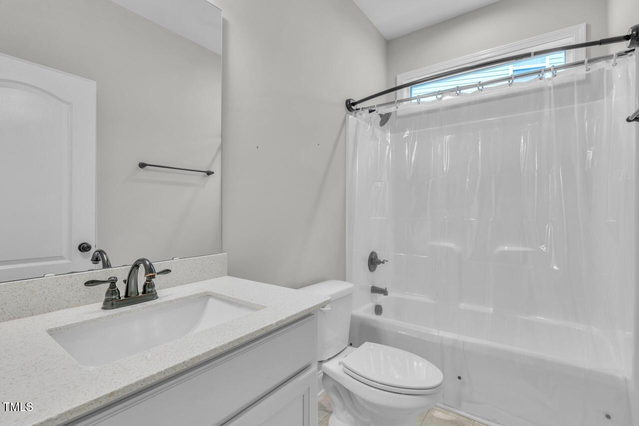 24 Highmeadow Lane Clayton, NC 27520 - Photo 29 of 37 a bathroom with a sink toilet and shower