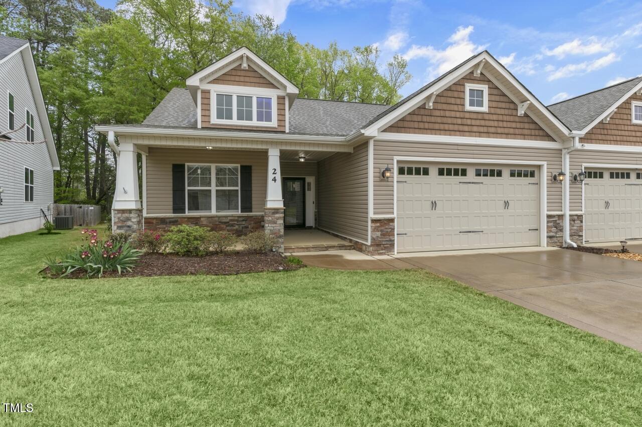 24 Highmeadow Lane Clayton, NC 27520 - Photo 2 of 37 a view of a house with a yard