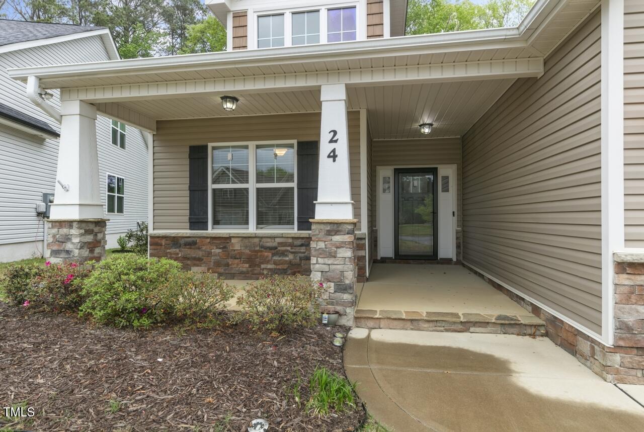 24 Highmeadow Lane Clayton, NC 27520 - Photo 4 of 37 a view of entrance gate of a house