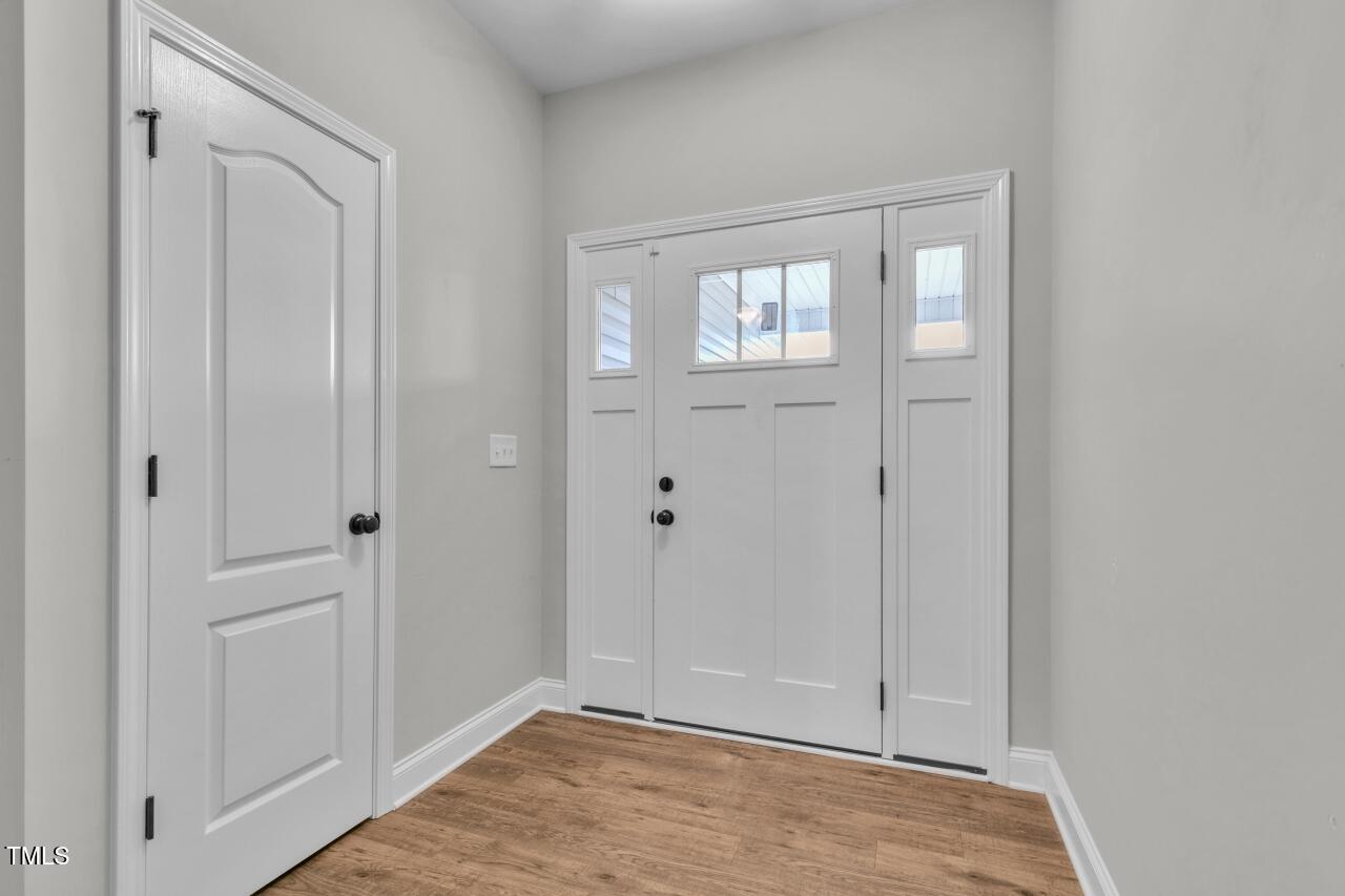 24 Highmeadow Lane Clayton, NC 27520 - Photo 5 of 37 a view of an empty room with wooden floor