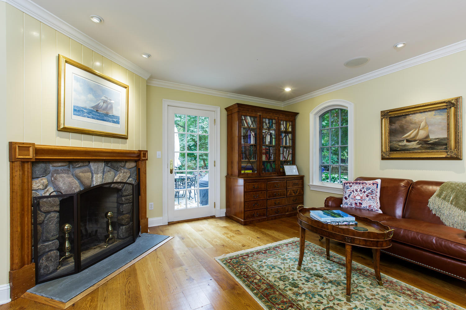 109 Rosebrook Road New Canaan, CT 06840 - Photo 19 of 47 a living room with furniture and a fireplace