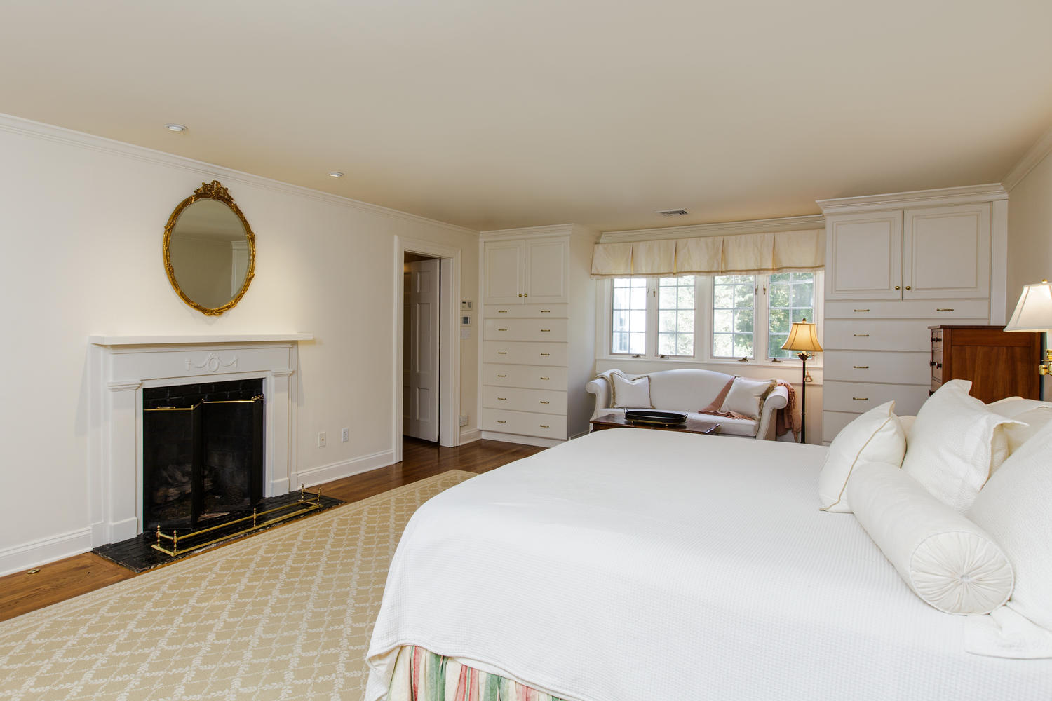 109 Rosebrook Road New Canaan, CT 06840 - Photo 23 of 47 a bedroom with bed and a fireplace