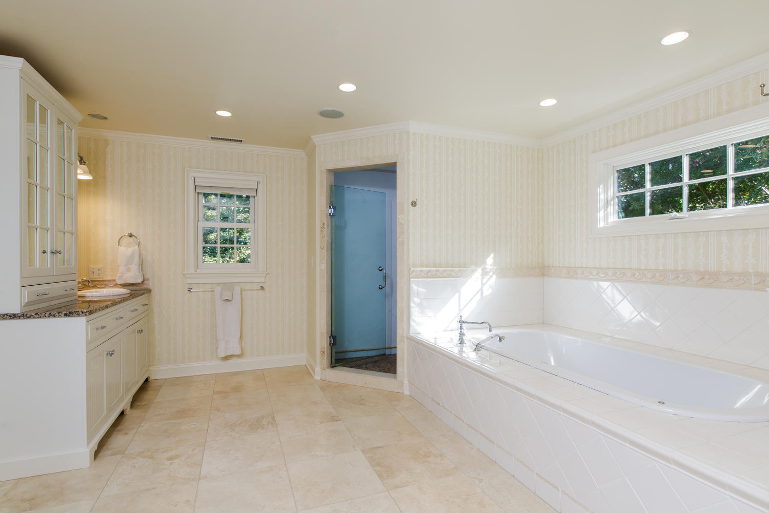 109 Rosebrook Road New Canaan, CT 06840 - Photo 24 of 47 a bathroom with a tub sink and mirror