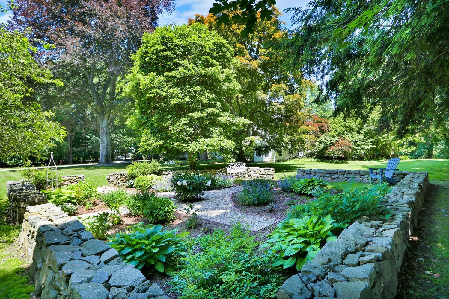 109 Rosebrook Road New Canaan, CT 06840 - Photo 37 of 47 a view of a garden with plants