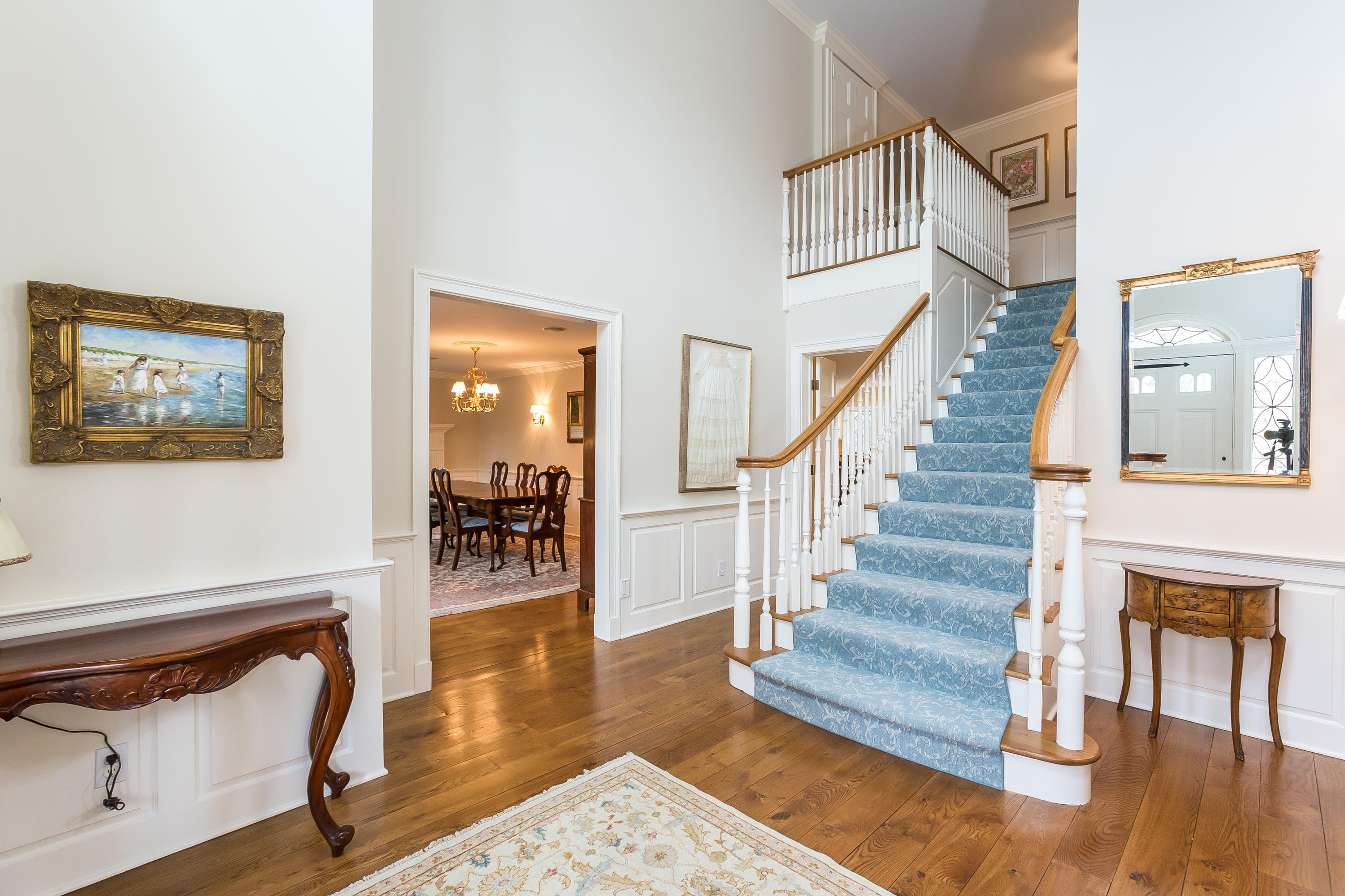 109 Rosebrook Road New Canaan, CT 06840 - Photo 7 of 47 a view of staircase with white walls and dining table