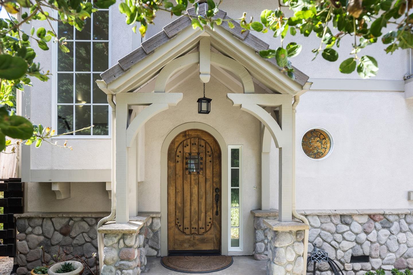 a front view of a house with garden
