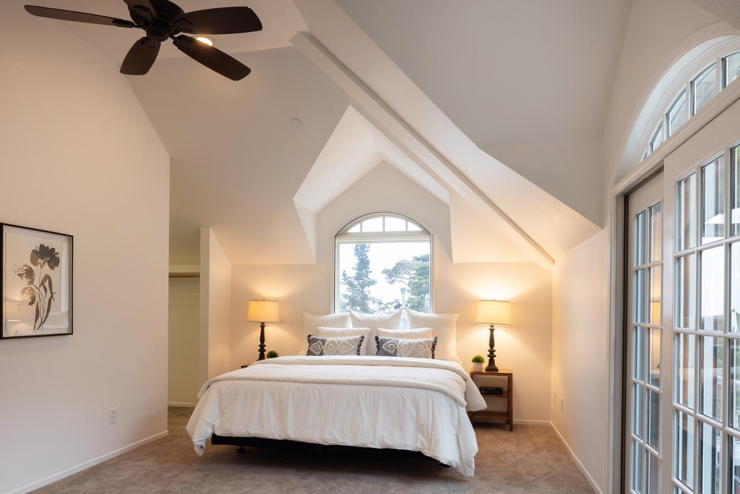 3288 Serra Avenue Carmel, CA 93923 - Photo 16 of 29 a bedroom with a bed and a large window