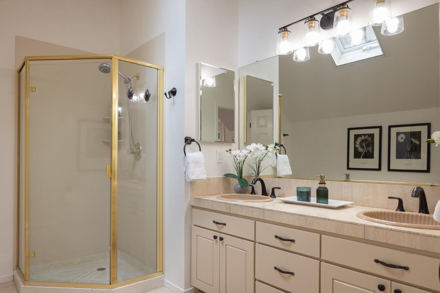 3288 Serra Avenue Carmel, CA 93923 - Photo 20 of 29 a bathroom with a double vanity sink mirror and shower