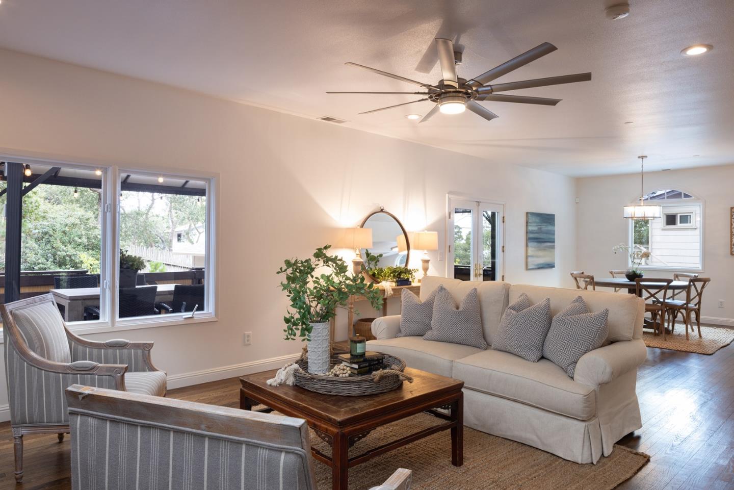 3288 Serra Avenue Carmel, CA 93923 - Photo 4 of 29 a living room with furniture a chandelier and a window