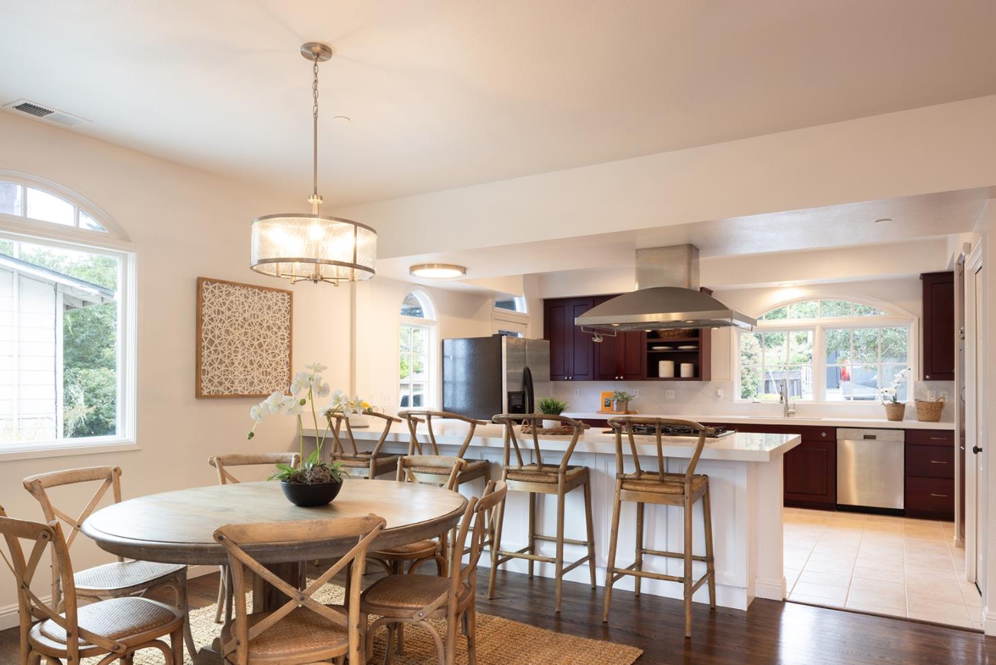 3288 Serra Avenue Carmel, CA 93923 - Photo 5 of 29 a view of a dining room and livingroom with furniture wooden floor a chandelier