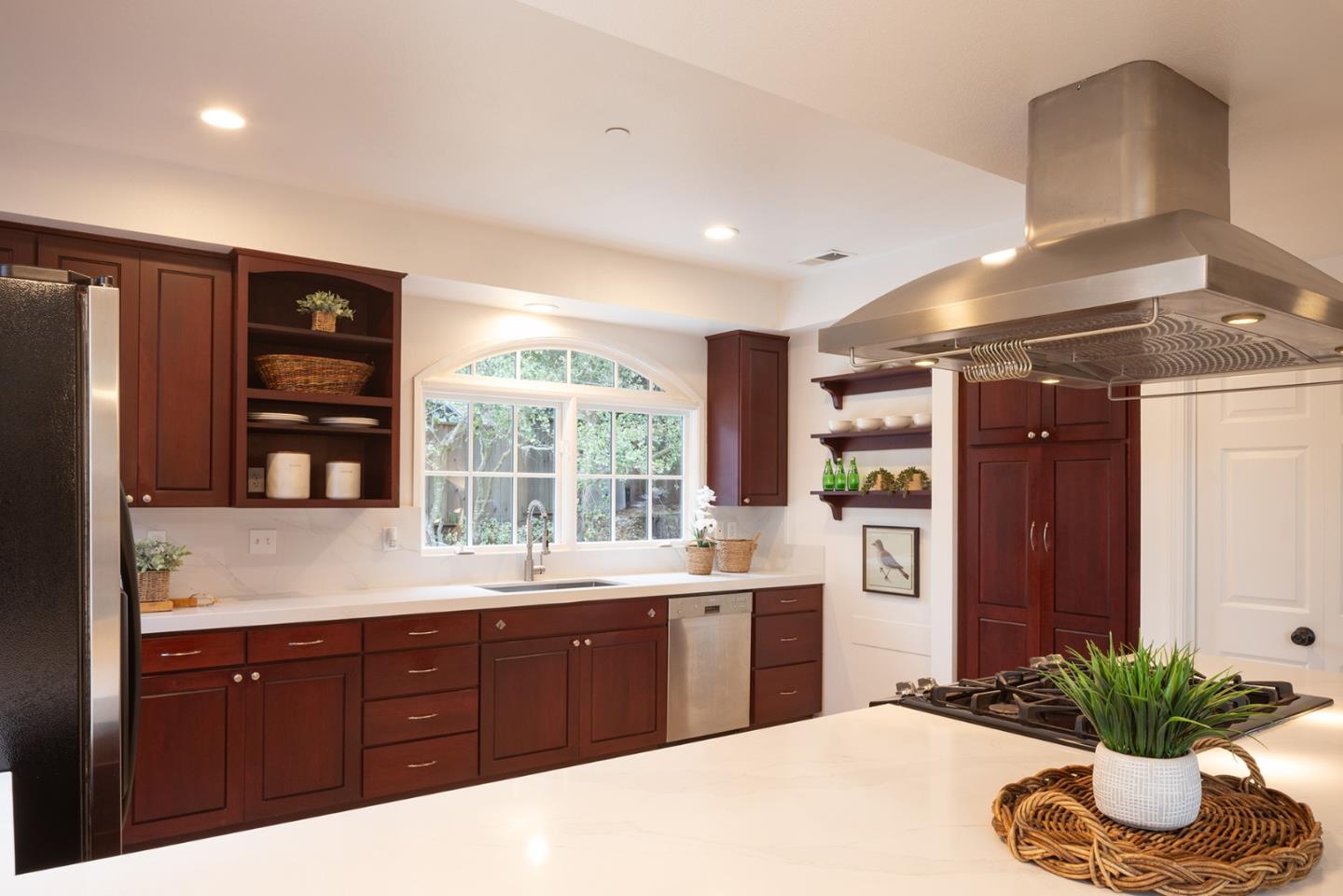 3288 Serra Avenue Carmel, CA 93923 - Photo 7 of 29 a kitchen with a sink and dishwasher with wooden floor