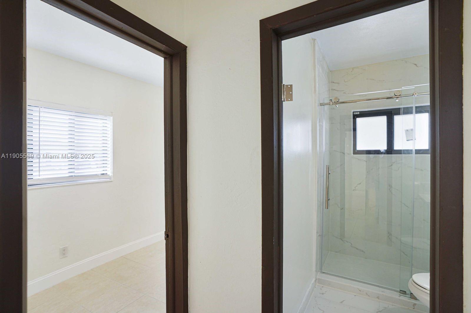 502 Northwest 7th Court, Unit 2 Hallandale Beach, FL 33009 - Photo 12 of 19 a bathroom with a bathtub