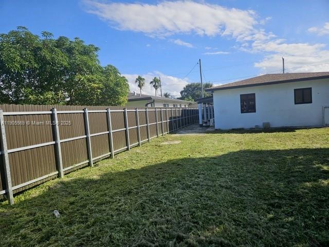 502 Northwest 7th Court, Unit 2 Hallandale Beach, FL 33009 - Photo 19 of 19 a view of a backyard with a garden