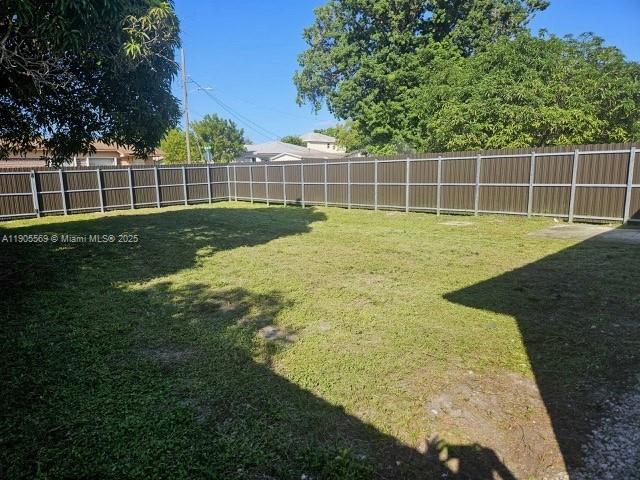 502 Northwest 7th Court, Unit 2 Hallandale Beach, FL 33009 - Photo 10 of 19 a view of a yard with a large trees