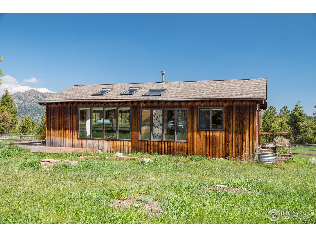 112 Deer Trail Road Boulder, CO 80302 - Photo 12 of 34 a view of a house with a yard and sitting area