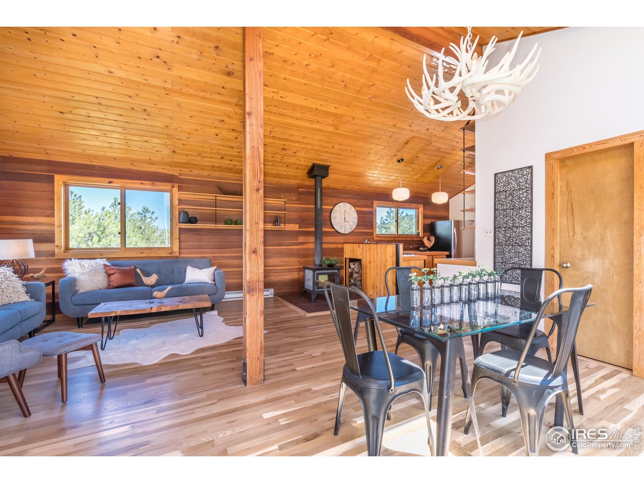 112 Deer Trail Road Boulder, CO 80302 - Photo 16 of 34 a dining room with furniture and wooden floor