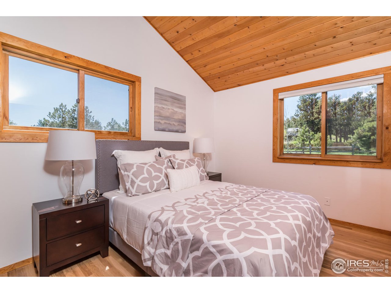 112 Deer Trail Road Boulder, CO 80302 - Photo 23 of 34 a bedroom with a bed and a window
