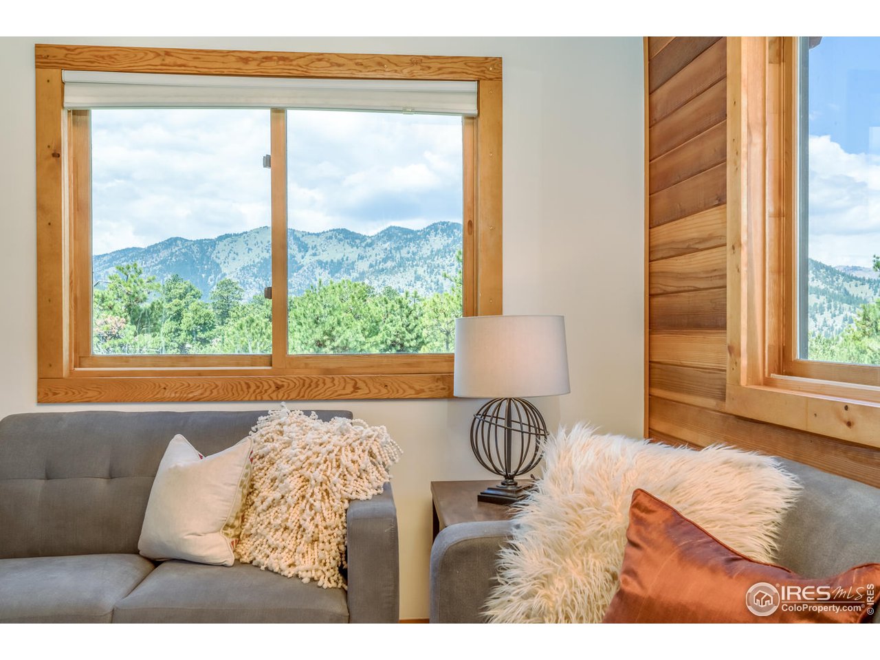 112 Deer Trail Road Boulder, CO 80302 - Photo 29 of 34 a bedroom with a bed and a large window